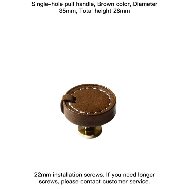 Brown leather decorative drawer pull knob with white stitching and brass hardware.